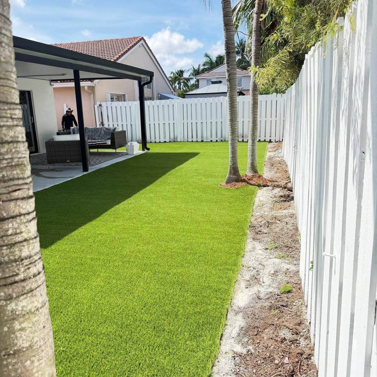 Cubmex crew installing artificial turf