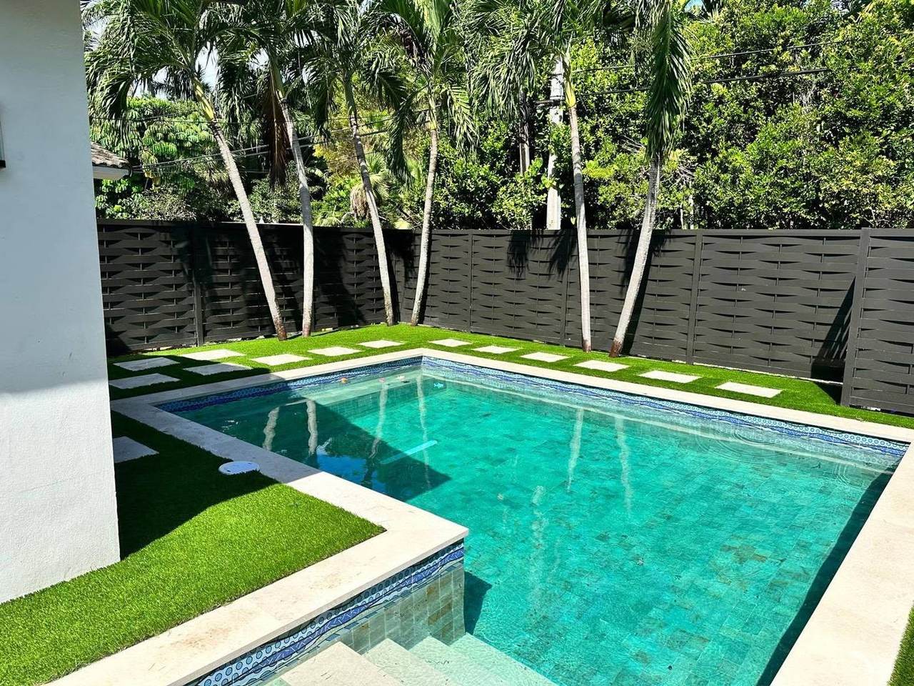Pool surround artificial turf installation