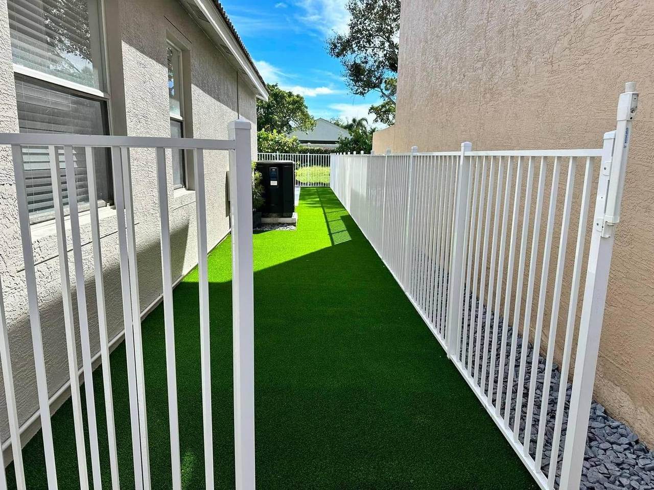 Side yard dog run turf installation