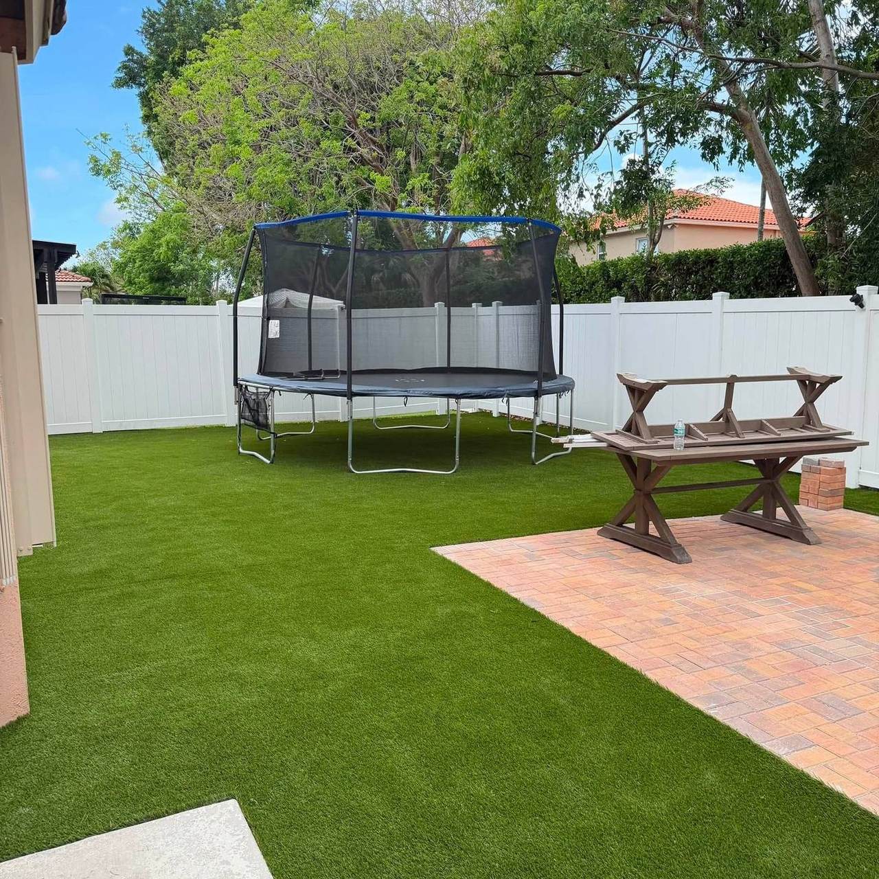 Backyard turf with trampoline and patio